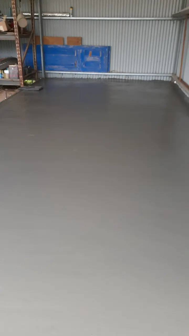 Smooth finished concrete floor inside a steel shed