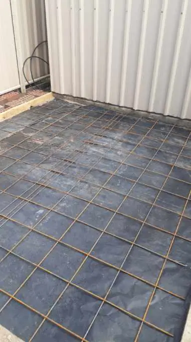 Slab area laid with plastic membrane and steel reinforcing mesh before the pour